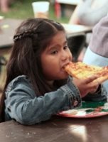 Girl enjoying pizza